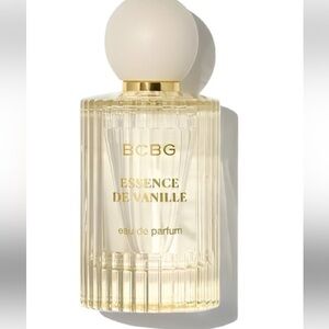 BCBG perfume bottle with cream cap and pale amber liquid